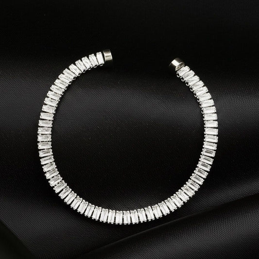 Silver rhinestone magnetic bracelet on a black background