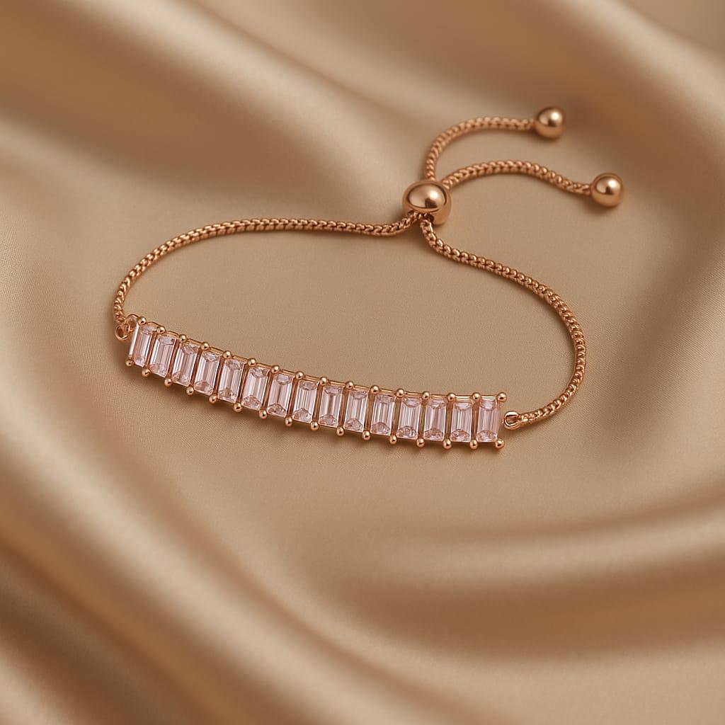 Rose gold bracelet with clear gemstones on a beige satin background